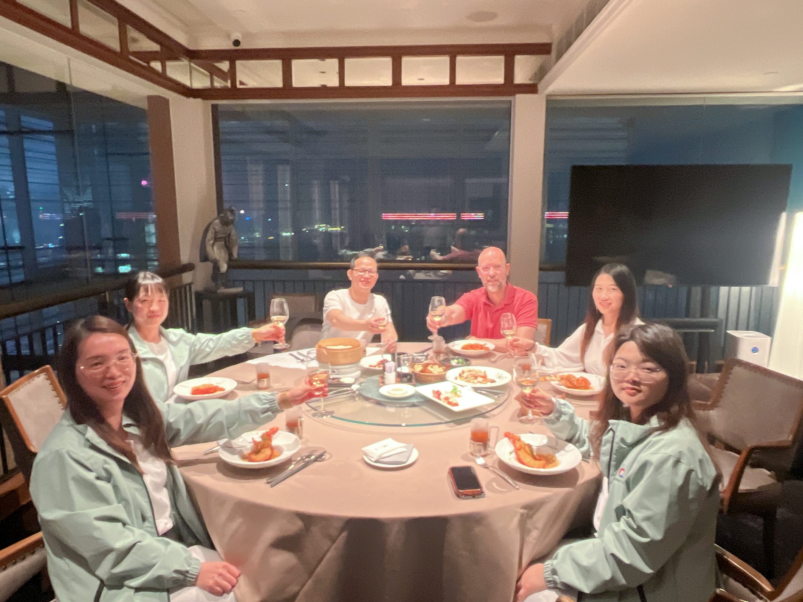 NaikeCraft team sharing a dinner with visiting buyers