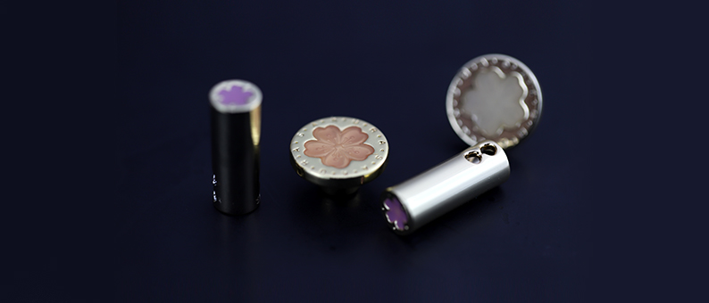 Close-up of metal apparel snap components