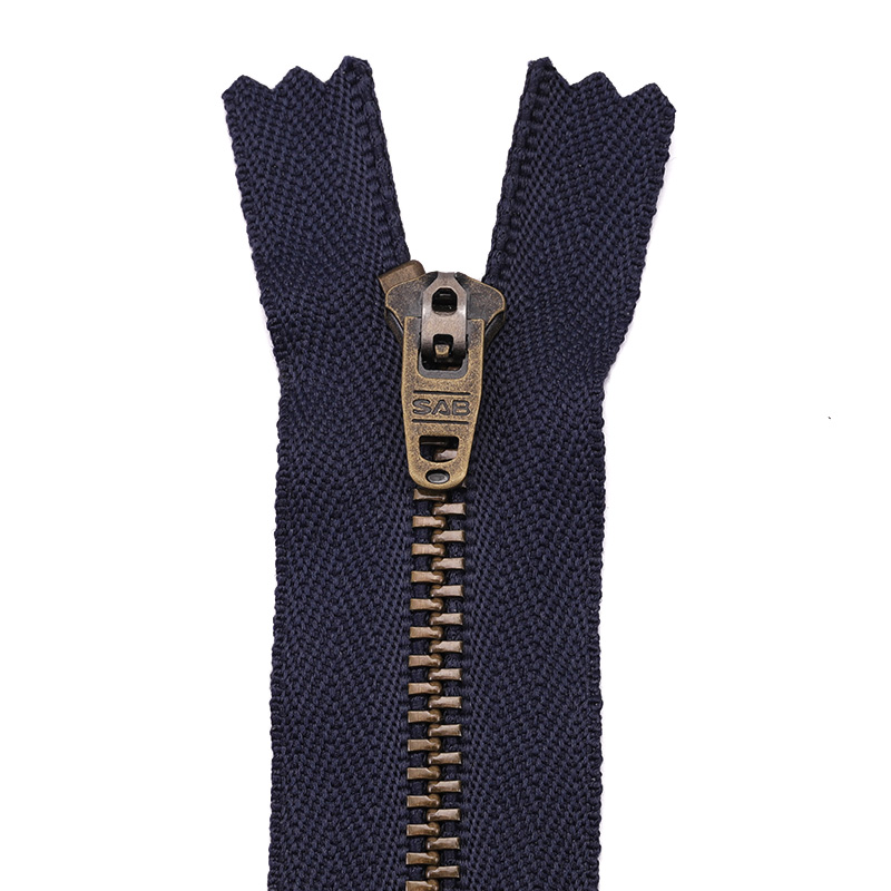 Metal zipper component for apparel